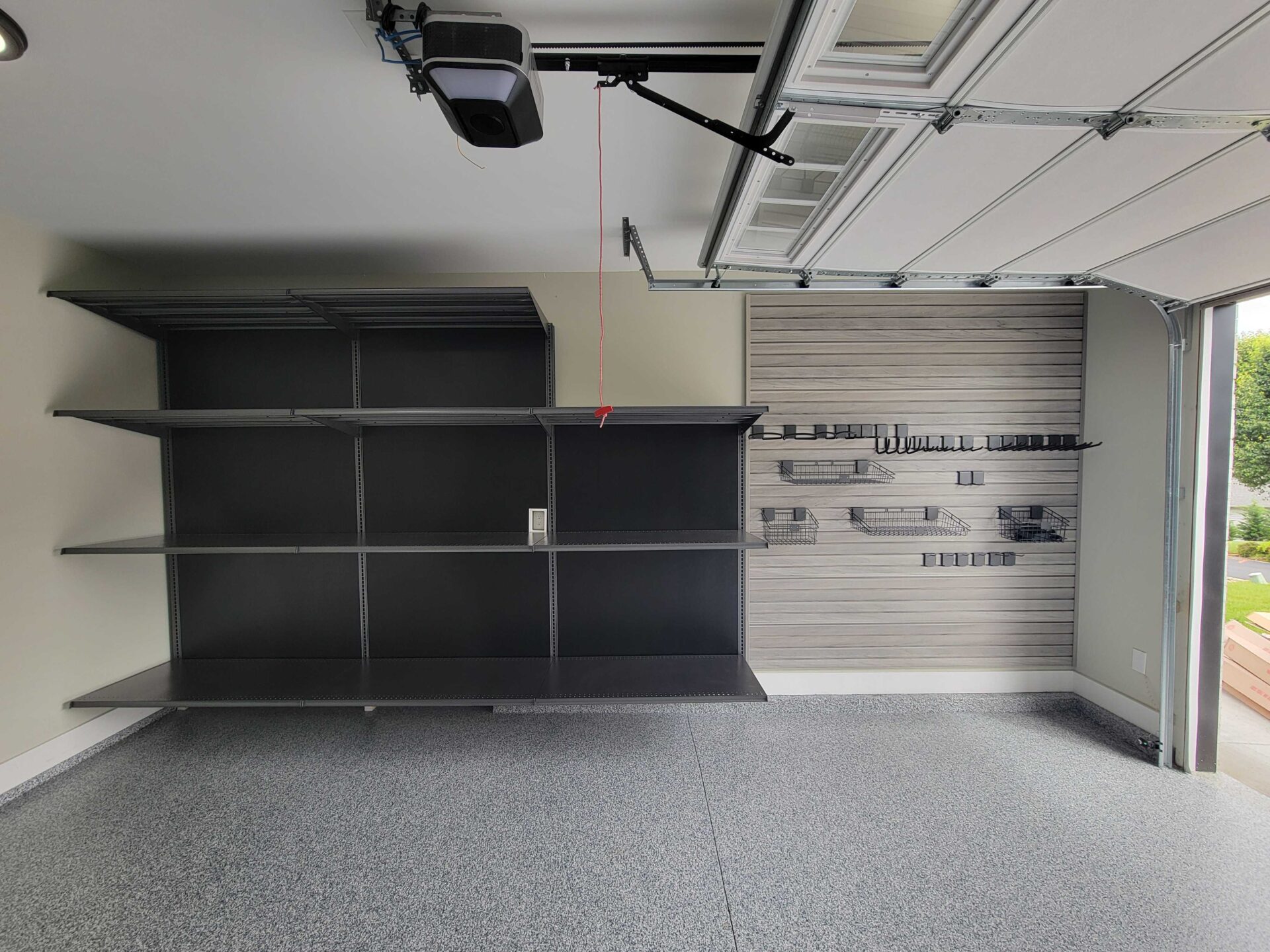 Garage with shelving and slatwall