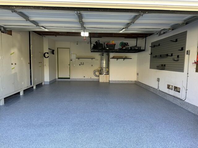 Garage with slatwall, overhead storage