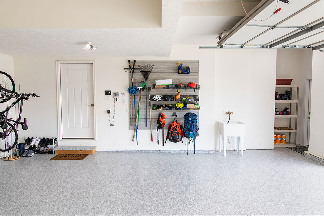 garage with new concrete floor coating and garage wall storage | Hello Garage