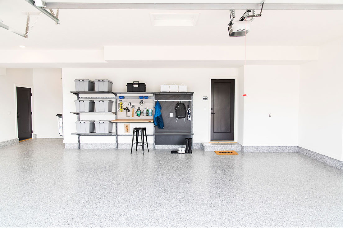 garage with new concrete floor coating and garage storage system | Hello Garage