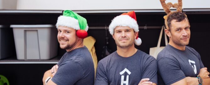 technicians in Christmas hats | Hello Garage