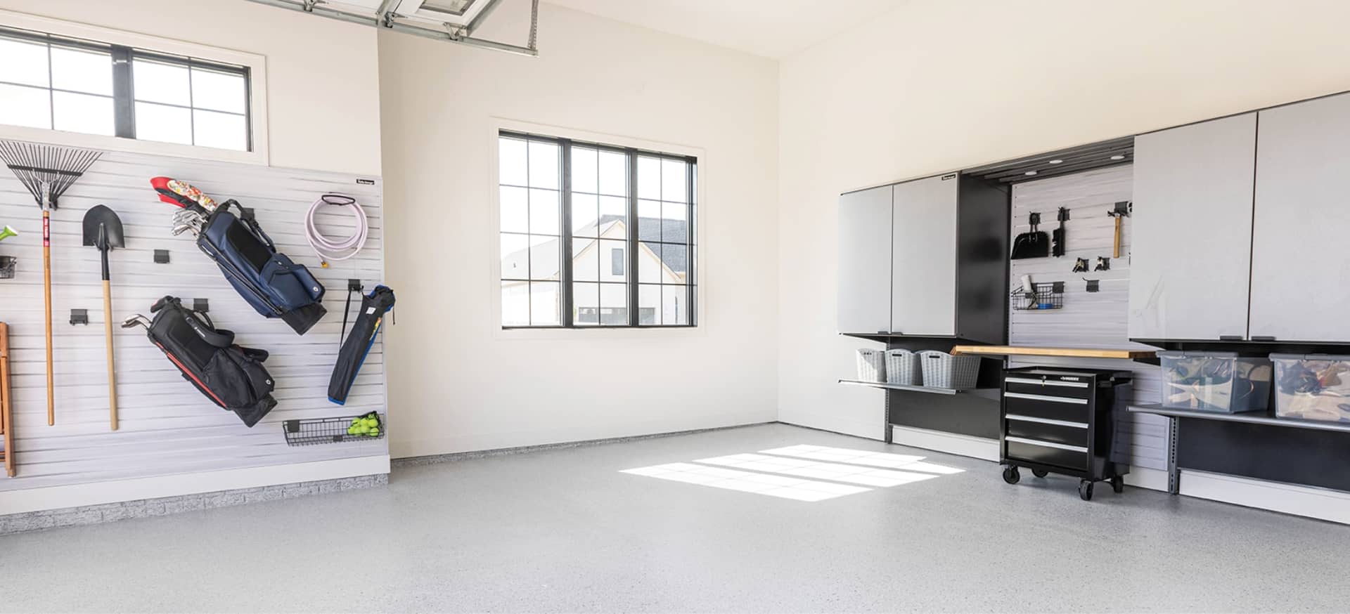 garage with new floor coating and garage storage systems | Hello Garage