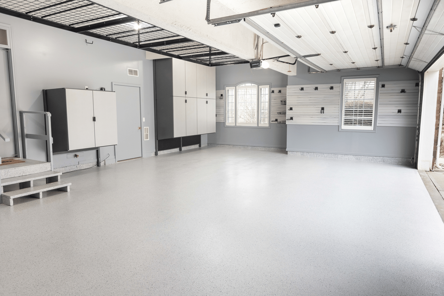 garage with new floor coating and garage storage systems | Hello Garage