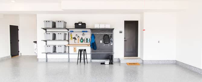 Clean garage with storage shelves and totes