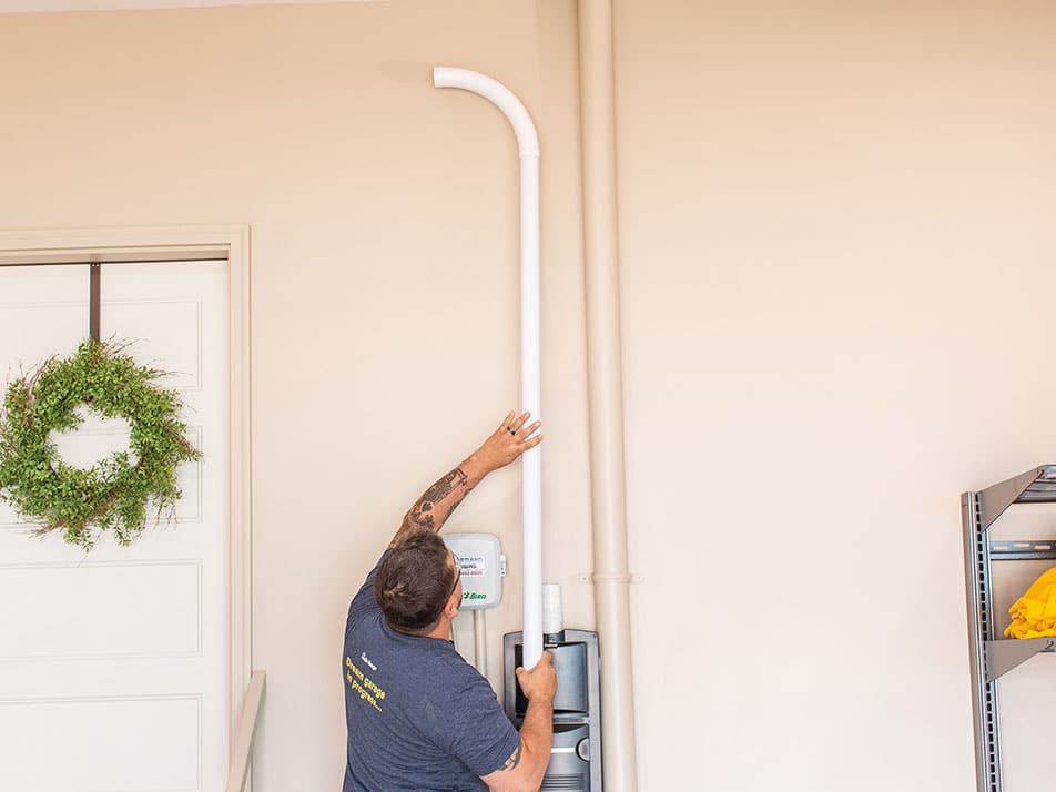 Technician installing accessories in garage