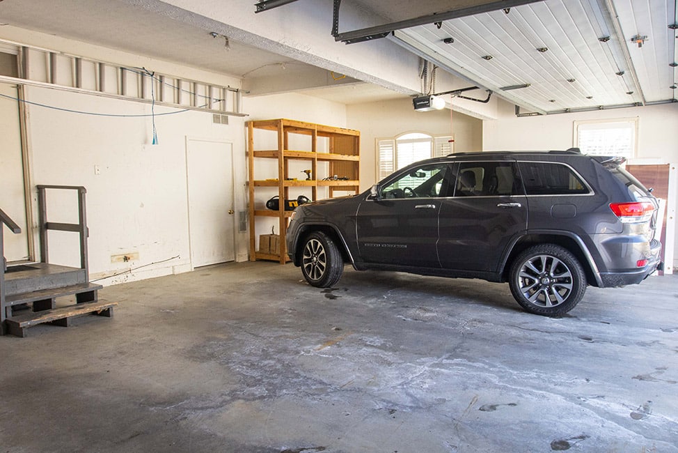 Car parked in unfinished garage