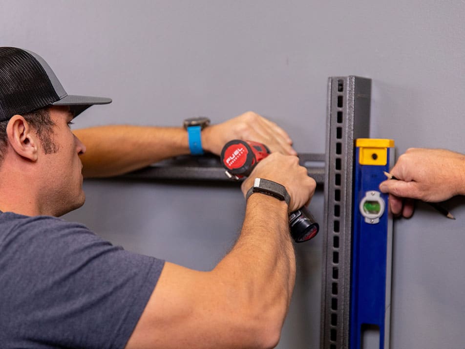 Technician installing a mud room shelf