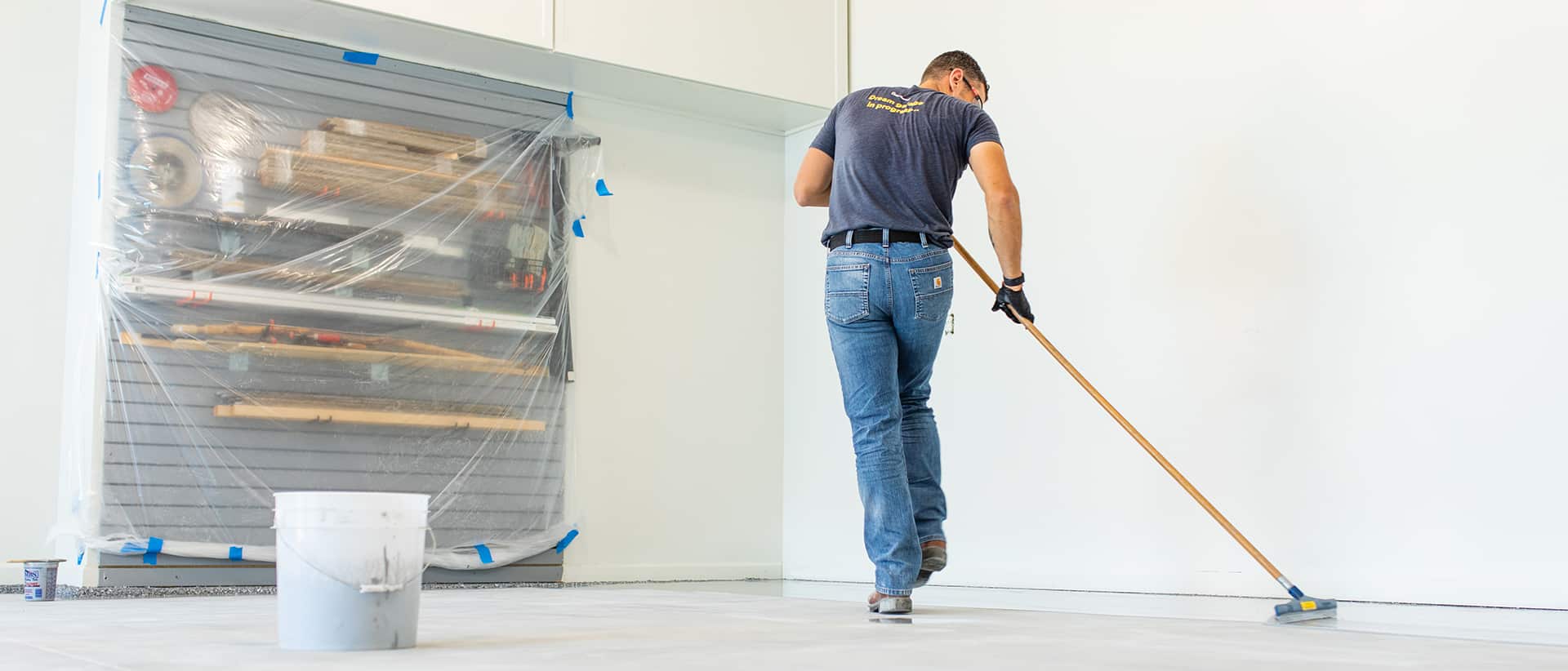 Technician applying cement coating